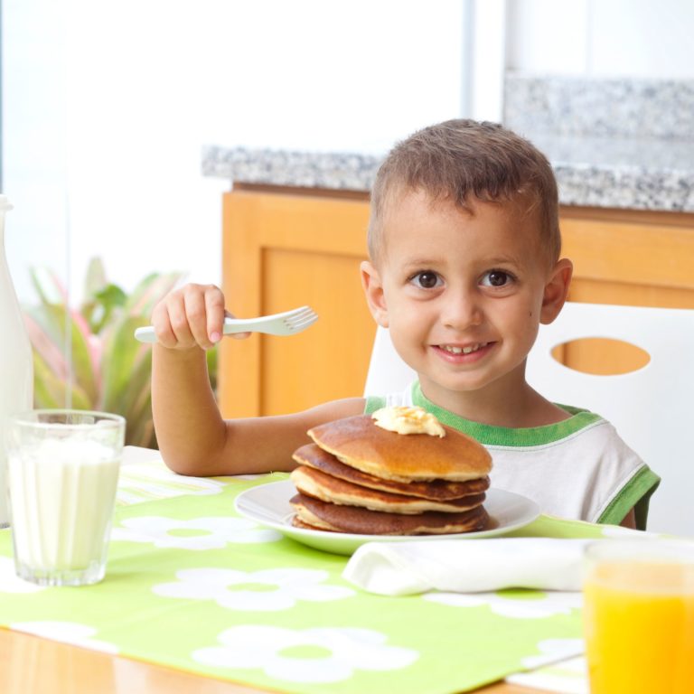 Happy boy eating